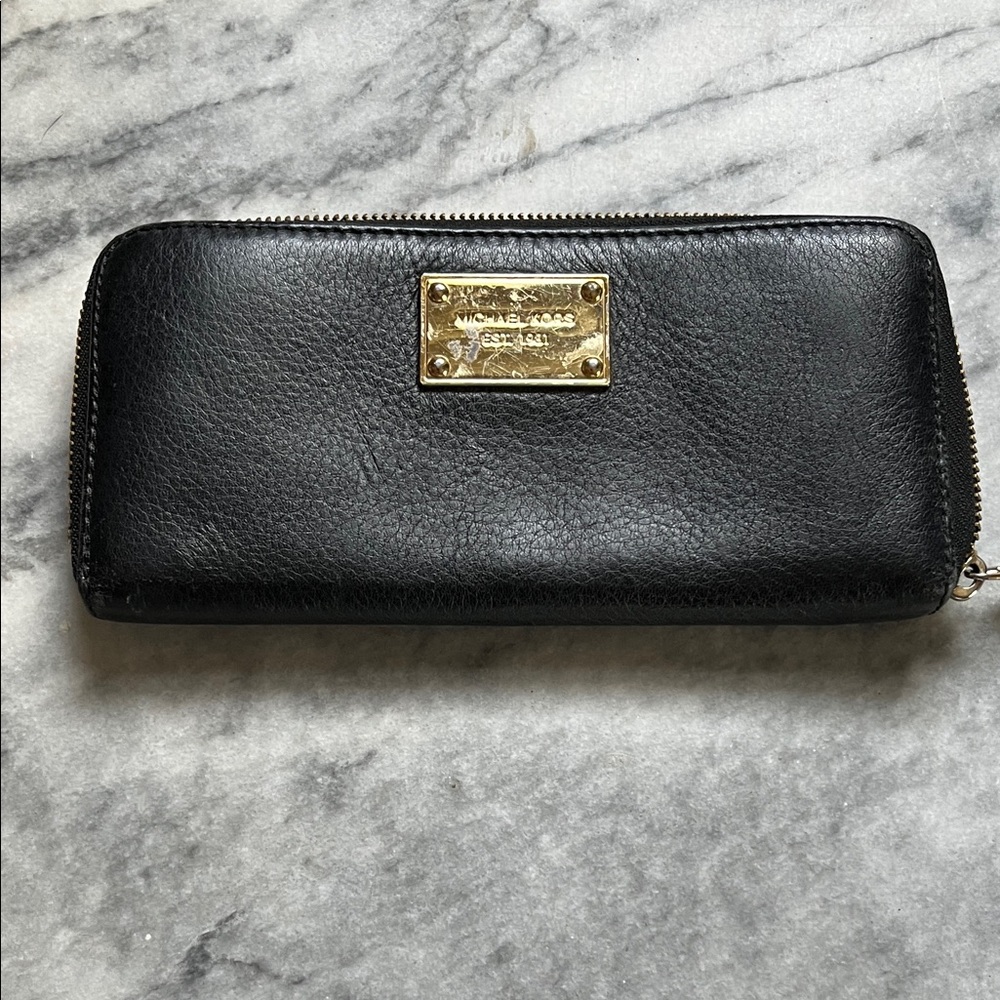 Michael Kors Black Leather Zip Wallet with Gold Plate Logo. In good used . Check